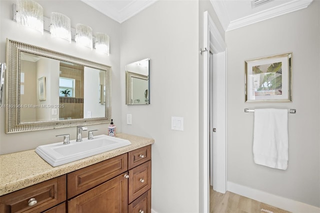 5318 Garfield St, Hollywood, FL 33021 - bathroom featuring ornamental molding, wood finished floors, vanity, and baseboards