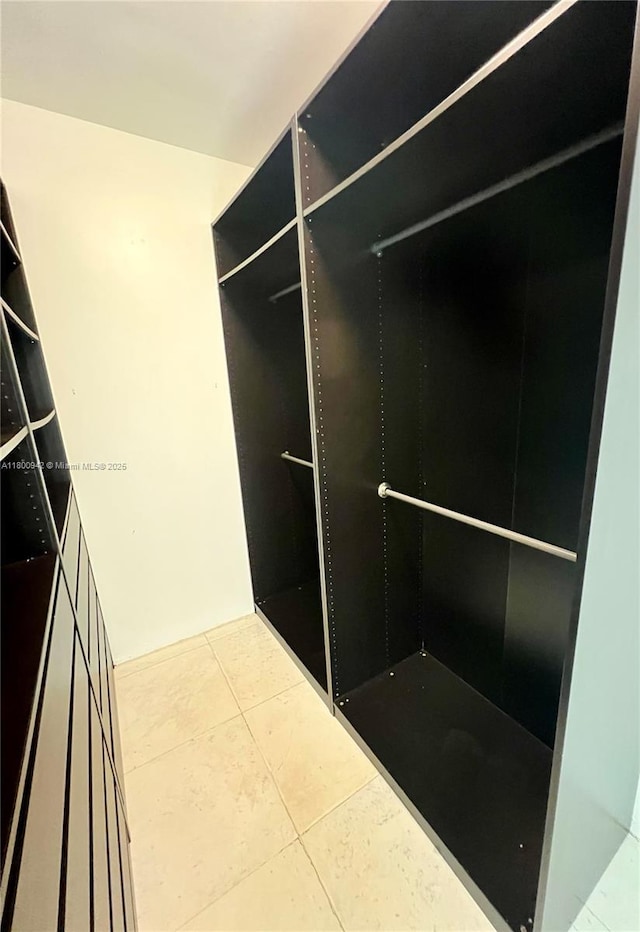 901 Brickell Key Blvd Unit 603, Miami, FL 33131 - spacious closet with tile patterned flooring