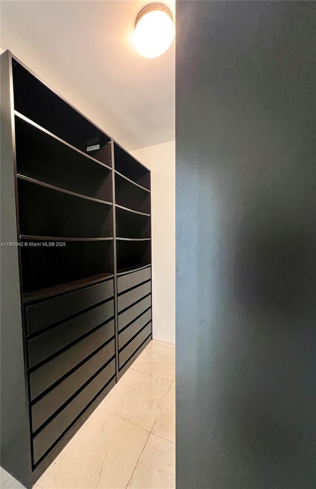 901 Brickell Key Blvd Unit 603, Miami, FL 33131 - walk in closet with tile patterned floors