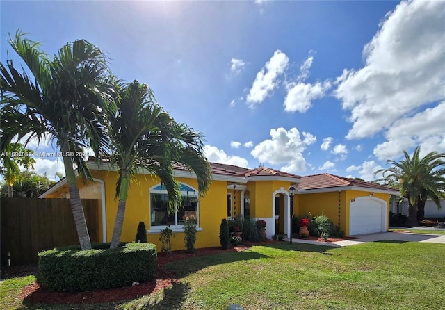 15216 SW 169th Ln, Miami, FL 33187 - mediterranean / spanish-style home featuring driveway, a garage, stucco siding, and a tiled roof