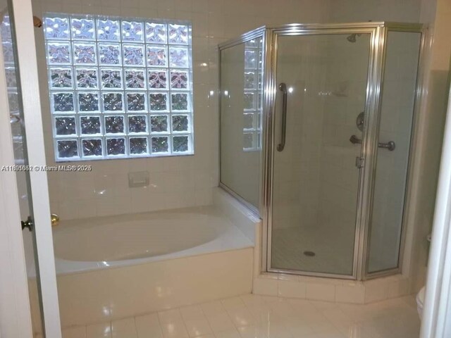 15216 SW 169th Ln, Miami, FL 33187 - full bathroom with a garden tub, a stall shower, tile patterned flooring, and toilet