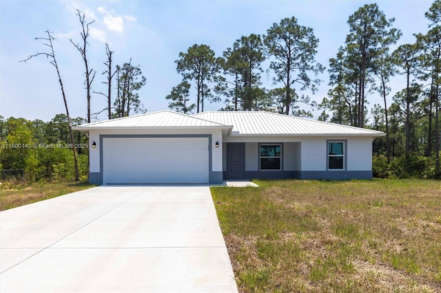 2004 Rosa Ct, Lehigh Acres, FL 33972 - view of front of home with stucco siding, a garage, driveway, metal roof, and a front yard