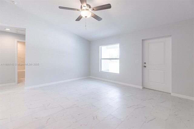 2004 Rosa Ct, Lehigh Acres, FL 33972 - spare room featuring ceiling fan, baseboards, and light marble finish flooring