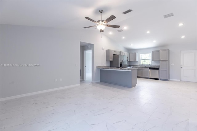 2004 Rosa Ct, Lehigh Acres, FL 33972 - kitchen with appliances with stainless steel finishes, gray cabinets, ceiling fan, a sink, and light marble finish flooring