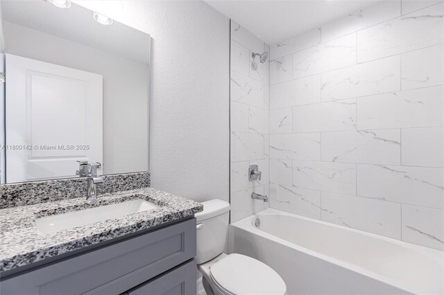 2004 Rosa Ct, Lehigh Acres, FL 33972 - full bathroom featuring toilet, vanity, and bathing tub / shower combination