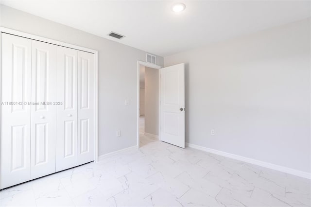 2004 Rosa Ct, Lehigh Acres, FL 33972 - unfurnished bedroom with light marble finish flooring, baseboards, and recessed lighting