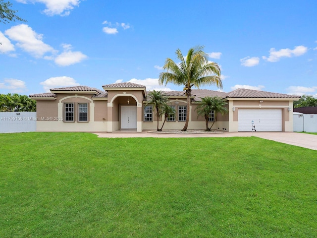 18760 SW 358th St, Homestead, FL 33034 - mediterranean / spanish-style house featuring stucco siding, concrete driveway, a garage, and a tile roof