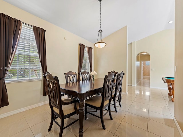 18760 SW 358th St, Homestead, FL 33034 - dining area with arched walkways, light tile patterned floors, lofted ceiling, and baseboards