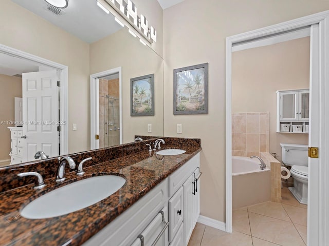 18760 SW 358th St, Homestead, FL 33034 - full bathroom featuring toilet, tile patterned flooring, a bath, double vanity, and baseboards
