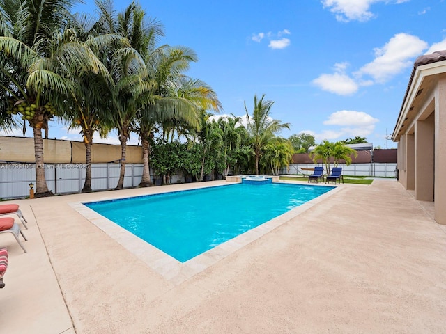 18760 SW 358th St, Homestead, FL 33034 - view of pool featuring a patio area, a fenced backyard, and a pool with connected hot tub