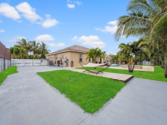 18760 SW 358th St, Homestead, FL 33034 - view of front of property featuring stucco siding, a patio, and a gate