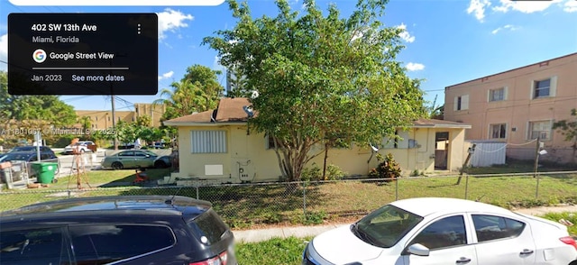 1268 SW 4th St, Miami, FL 33135 - view of side of home with fence and stucco siding