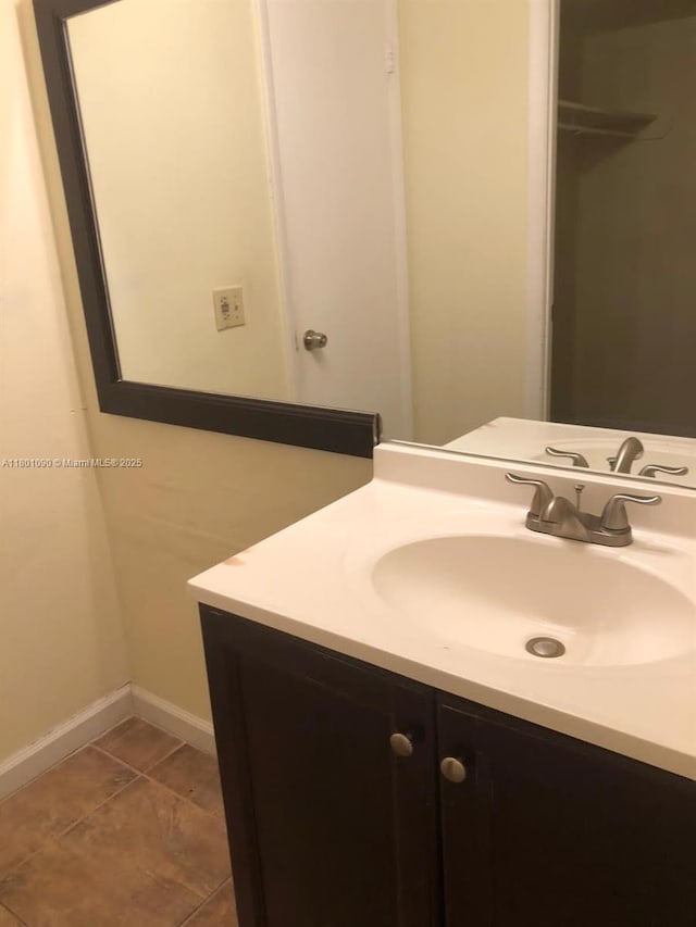 492 NW 165th St Rd Unit C514, Miami, FL 33169 - bathroom with baseboards, vanity, and tile patterned flooring