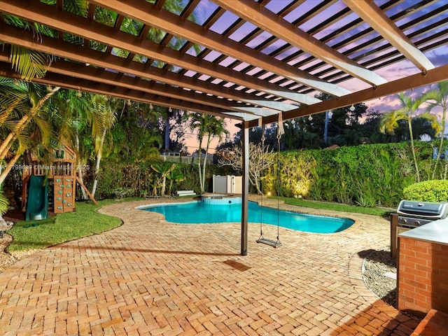 1125 Asturia Ave, Coral Gables, FL 33134 - view of pool with a patio, a pergola, a fenced backyard, and exterior kitchen