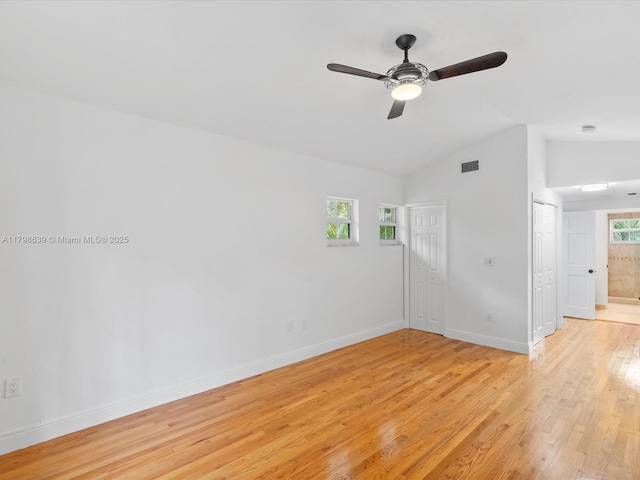 1125 Asturia Ave, Coral Gables, FL 33134 - unfurnished room featuring light wood finished floors, baseboards, ceiling fan, and high vaulted ceiling