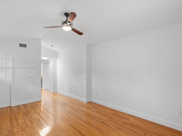 1125 Asturia Ave, Coral Gables, FL 33134 - unfurnished room with lofted ceiling, light wood finished floors, a ceiling fan, and baseboards