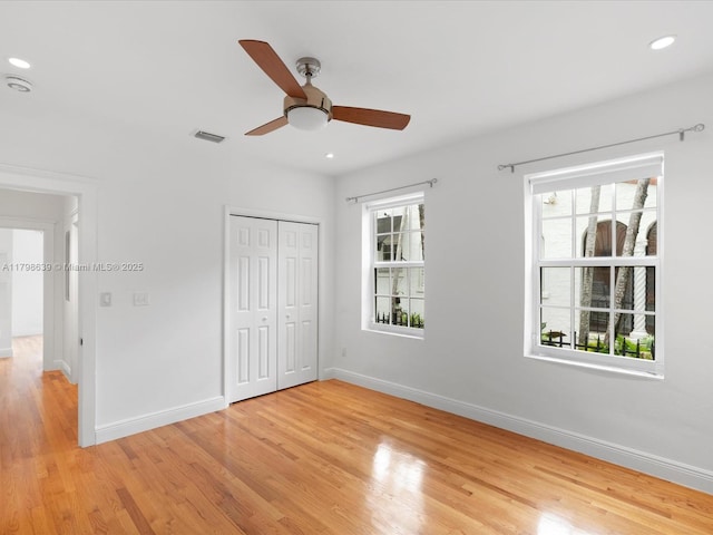 1125 Asturia Ave, Coral Gables, FL 33134 - unfurnished bedroom featuring light wood finished floors, baseboards, a closet, recessed lighting, and ceiling fan