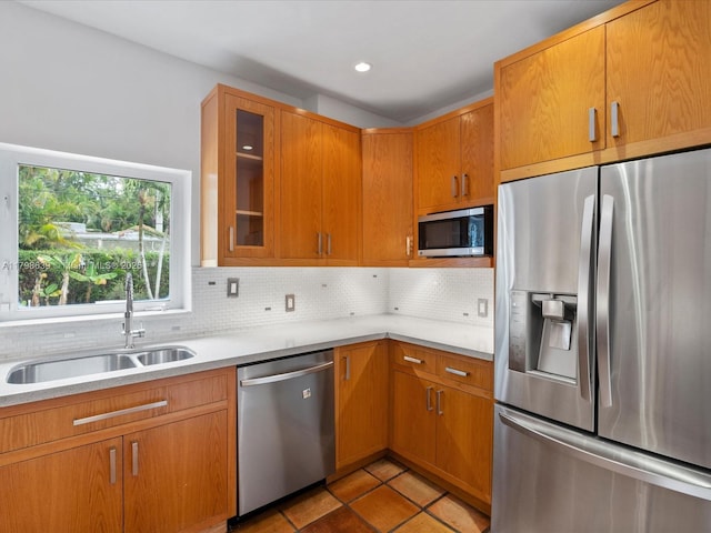 1125 Asturia Ave, Coral Gables, FL 33134 - kitchen with appliances with stainless steel finishes, a sink, light countertops, backsplash, and recessed lighting