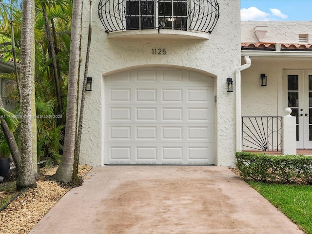 1125 Asturia Ave, Coral Gables, FL 33134 - garage with french doors and driveway