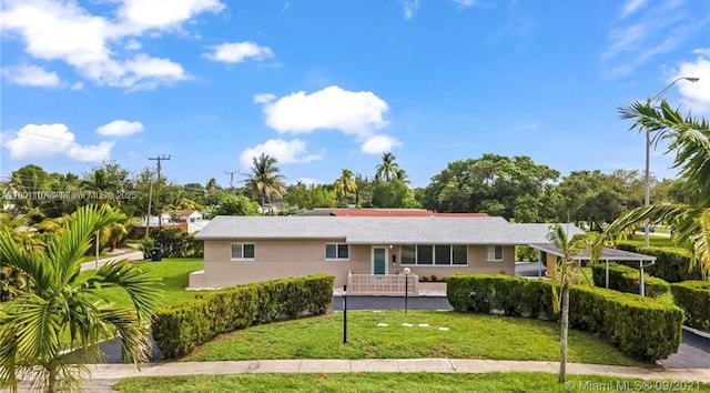 1900 NE 180th St, North Miami Beach, FL 33162 - single story home featuring a front lawn and stucco siding