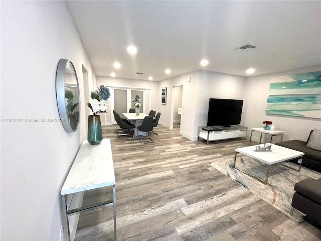 1900 NE 180th St, North Miami Beach, FL 33162 - living room featuring wood finished floors, recessed lighting, and baseboards