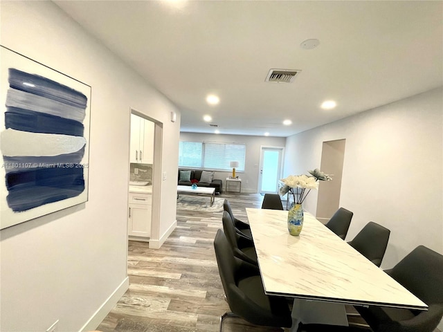 1900 NE 180th St, North Miami Beach, FL 33162 - dining area featuring light wood-type flooring, recessed lighting, and baseboards