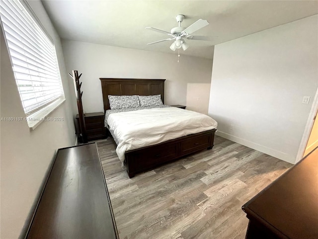 1900 NE 180th St, North Miami Beach, FL 33162 - bedroom featuring light wood finished floors, a ceiling fan, and baseboards