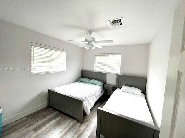 1900 NE 180th St, North Miami Beach, FL 33162 - bedroom featuring wood finished floors, a ceiling fan, and baseboards