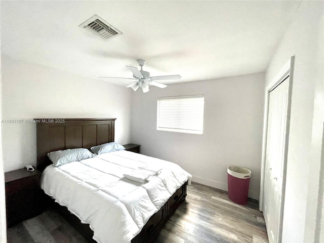 1900 NE 180th St, North Miami Beach, FL 33162 - bedroom with a closet, light wood-style flooring, a ceiling fan, and baseboards