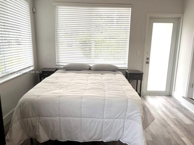 1900 NE 180th St, North Miami Beach, FL 33162 - bedroom featuring wood finished floors