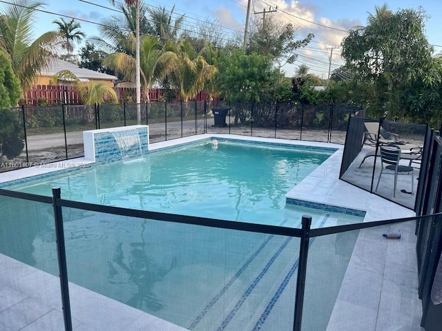 1900 NE 180th St, North Miami Beach, FL 33162 - view of swimming pool with fence and a patio area