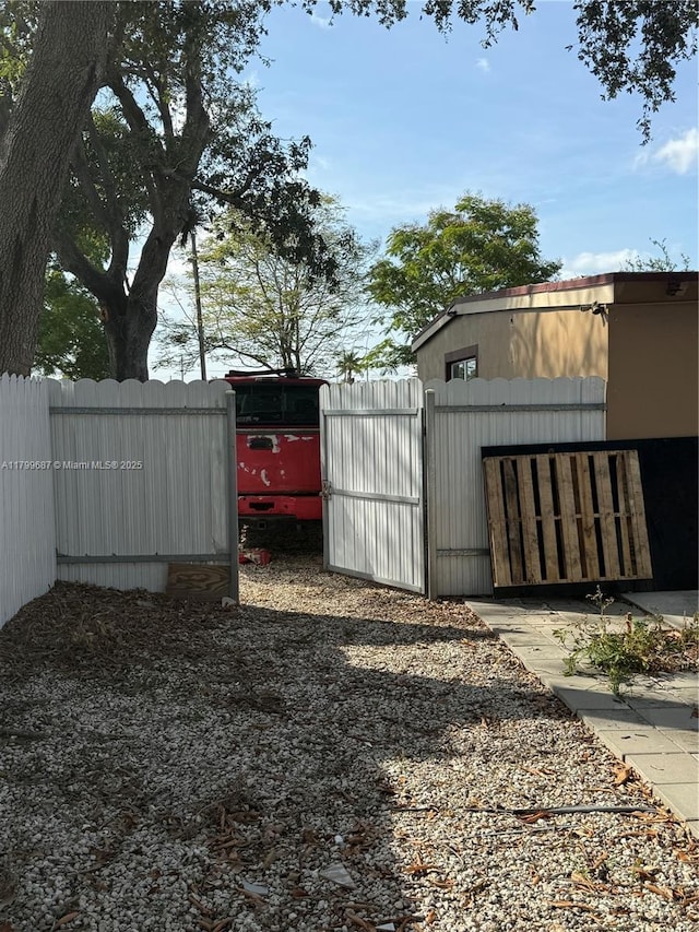 view of outdoor structure with a gate and fence