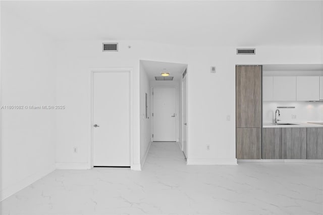 2900 NE 7th Ave Unit 1409, Miami, FL 33137 - spare room with light marble finish floors and a sink