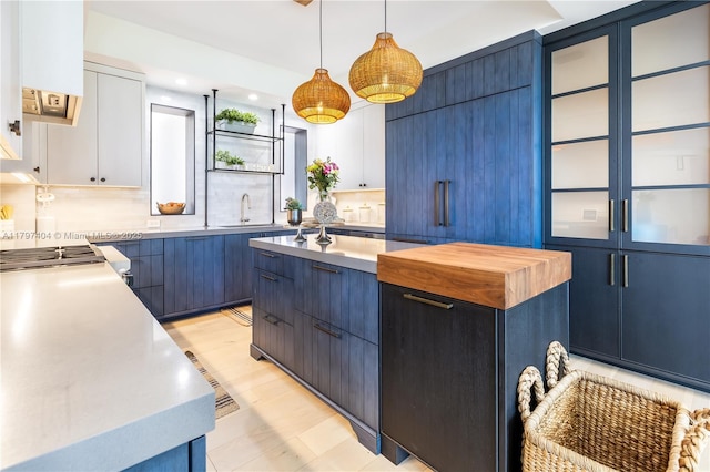 2120 N Ocean Blvd Vii, Unit Vii, Fort Lauderdale, FL 33305 - kitchen with light countertops, blue cabinetry, a sink, pendant lighting, and recessed lighting