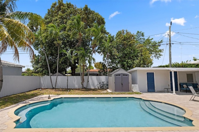6811 SW 5th Ter, Miami, FL 33144 - view of pool with a fenced backyard, a patio, a storage shed, and an outbuilding