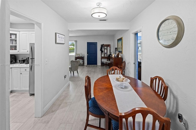 6811 SW 5th Ter, Miami, FL 33144 - dining room with light wood-style flooring and baseboards