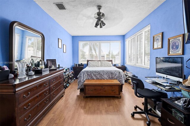 6811 SW 5th Ter, Miami, FL 33144 - bedroom with wood finished floors, a textured ceiling, an office area, and ceiling fan