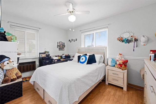 6811 SW 5th Ter, Miami, FL 33144 - bedroom with radiator, light wood finished floors, and a ceiling fan