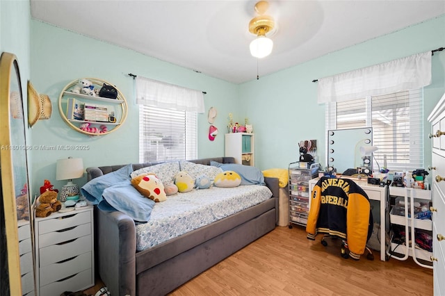6811 SW 5th Ter, Miami, FL 33144 - bedroom with multiple windows, wood finished floors, and a ceiling fan