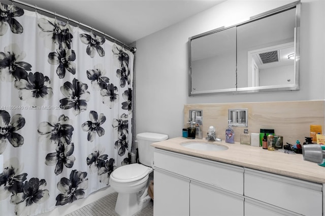 5700 Collins Ave Unit 4A, Miami Beach, FL 33140 - bathroom featuring tile patterned flooring, toilet, vanity, curtained shower, and backsplash