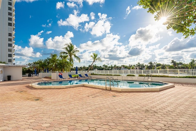 5700 Collins Ave Unit 4A, Miami Beach, FL 33140 - community pool featuring fence and a patio