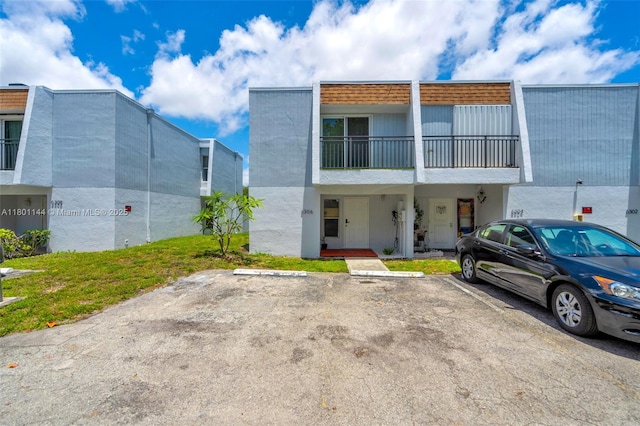 6306 Moseley St Unit 1, Hollywood, FL 33024 - townhome / multi-family property featuring uncovered parking and stucco siding