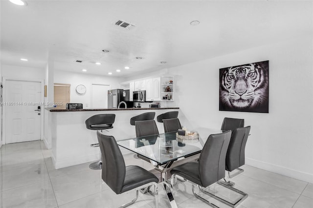 6306 Moseley St Unit 1, Hollywood, FL 33024 - dining area with recessed lighting, baseboards, and light tile patterned flooring