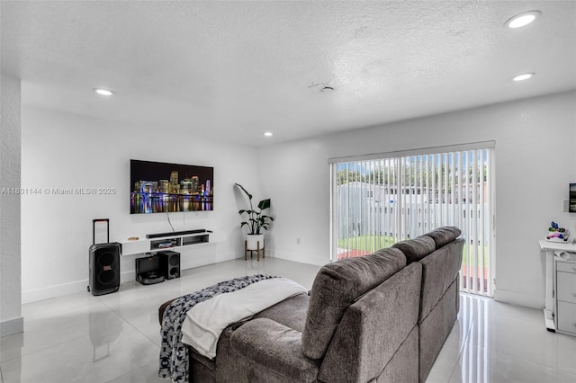 6306 Moseley St Unit 1, Hollywood, FL 33024 - living room featuring recessed lighting, a textured ceiling, and tile patterned floors