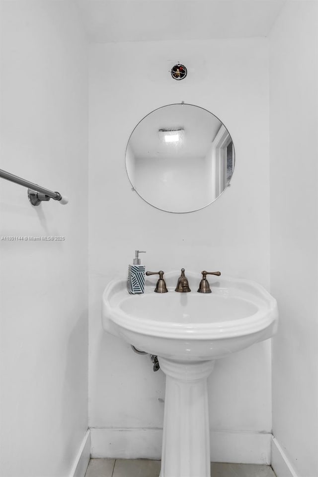 6306 Moseley St Unit 1, Hollywood, FL 33024 - bathroom with tile patterned floors and baseboards