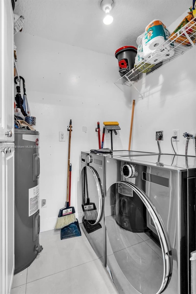 6306 Moseley St Unit 1, Hollywood, FL 33024 - clothes washing area featuring electric water heater, separate washer and dryer, and tile patterned flooring