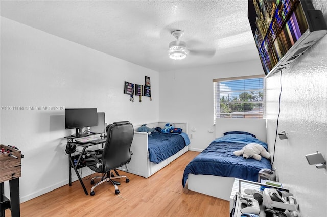 6306 Moseley St Unit 1, Hollywood, FL 33024 - bedroom with wood finished floors, baseboards, a desk, a textured ceiling, and a ceiling fan