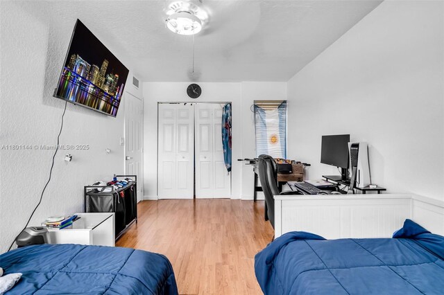 6306 Moseley St Unit 1, Hollywood, FL 33024 - bedroom with light wood-type flooring, a desk, and a closet