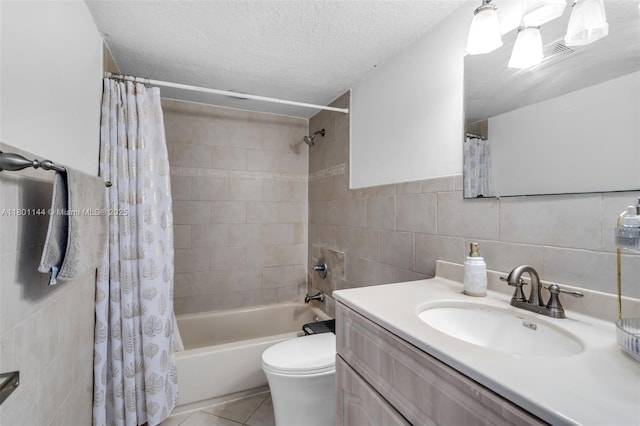 6306 Moseley St Unit 1, Hollywood, FL 33024 - bathroom featuring tile walls, vanity, shower / bath combo with shower curtain, tile patterned floors, and a textured ceiling