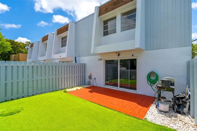 6306 Moseley St Unit 1, Hollywood, FL 33024 - rear view of house featuring fence and stucco siding